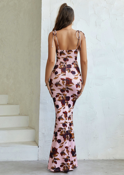 Back view of pink floral maxi dress with tie-shoulder straps and ruched fit
