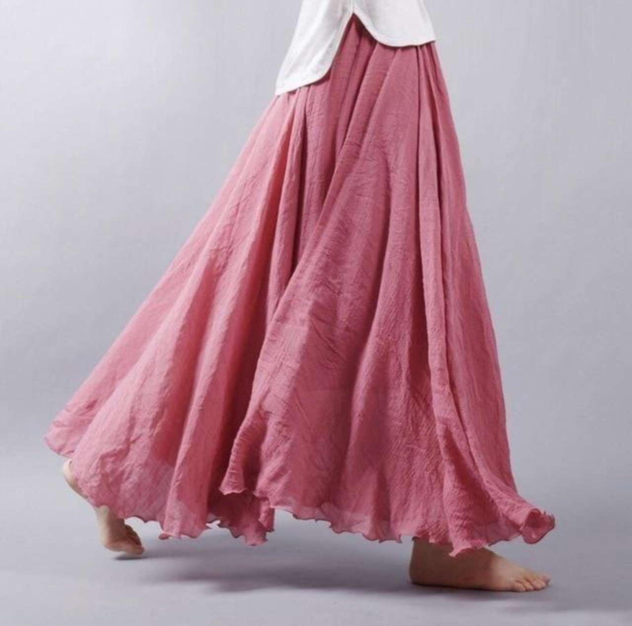 Mauve pink pleated maxi skirt showing rich color and full volume