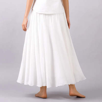 White pleated maxi skirt detail showing fine pleats and hem
