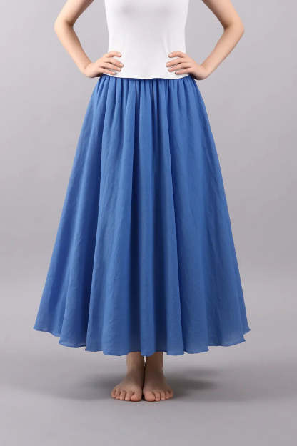 Blue pleated maxi skirt front view with structured waist detail