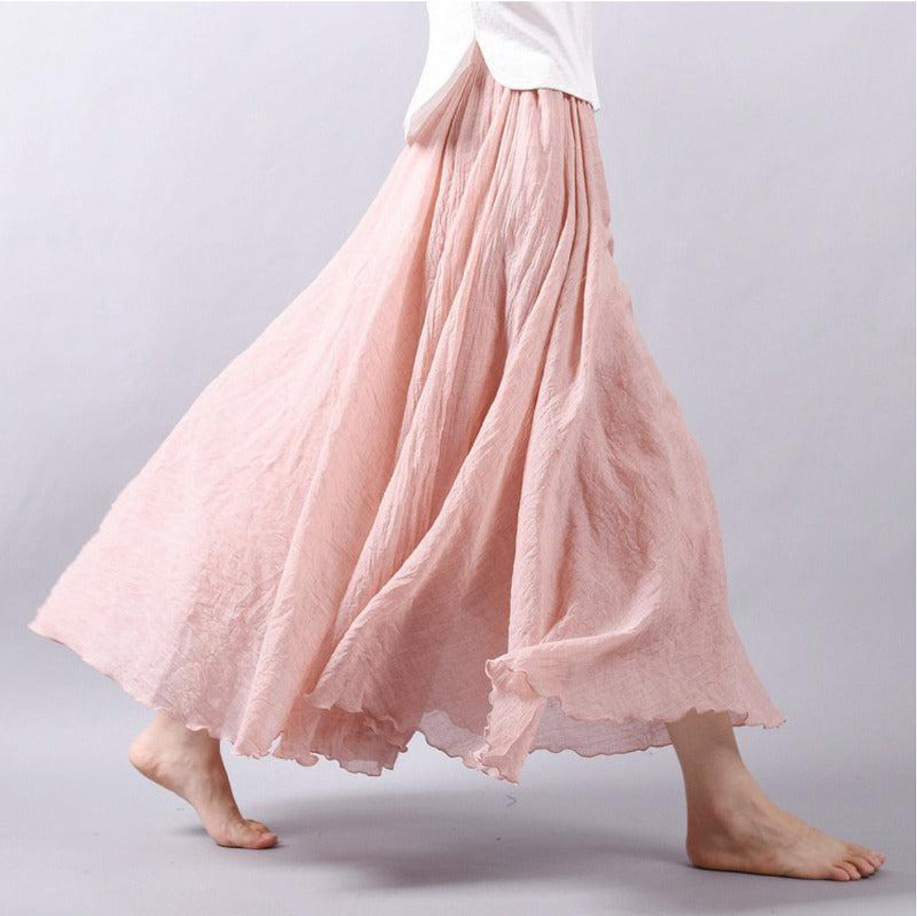 Blush pink pleated maxi skirt with soft romantic pleating