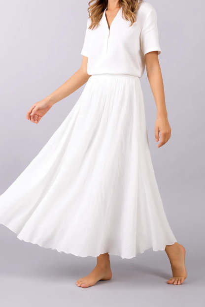 White pleated maxi skirt with flowing ankle-length silhouette