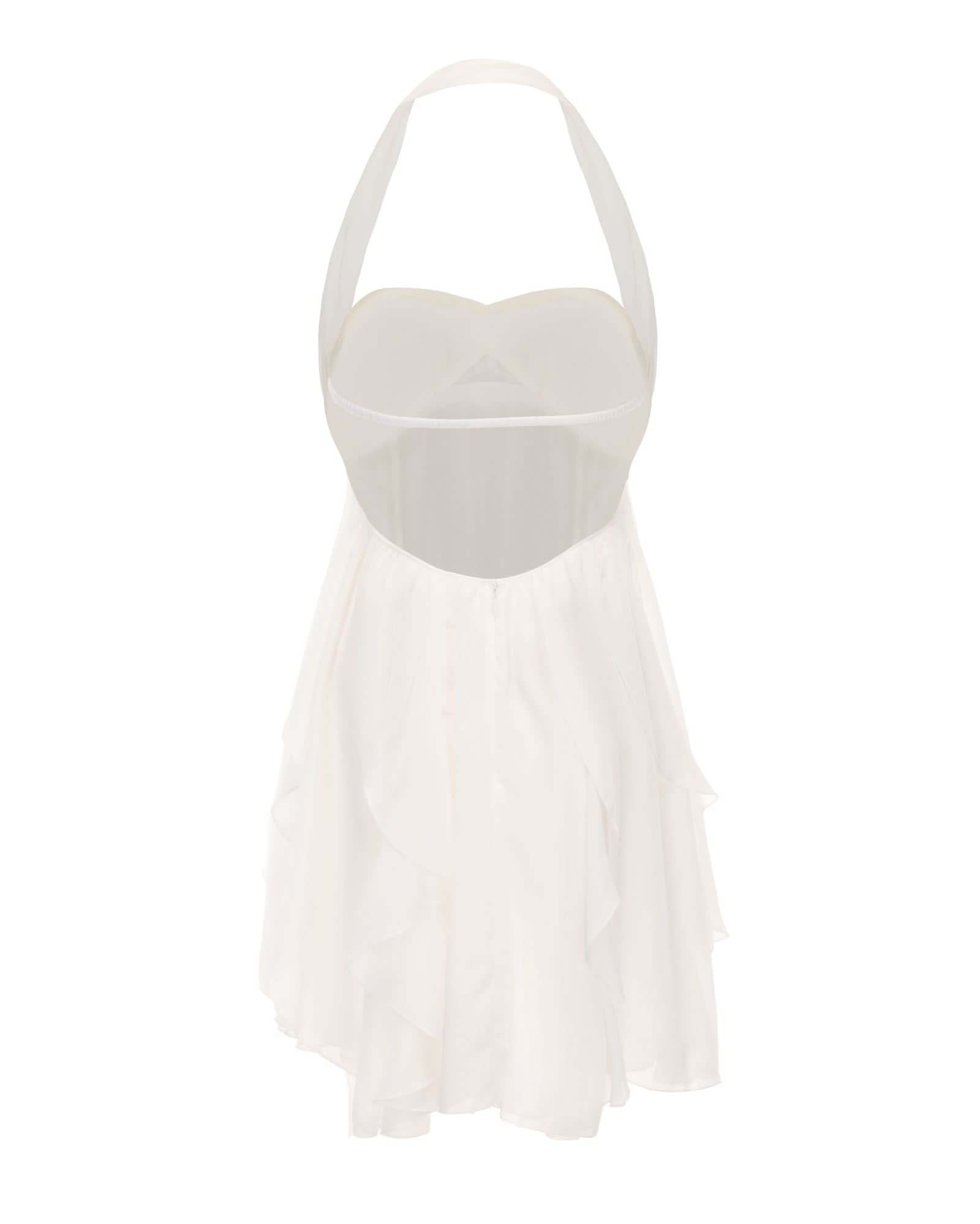 Back view of cream halter dress showing open back and layered ruffle skirt