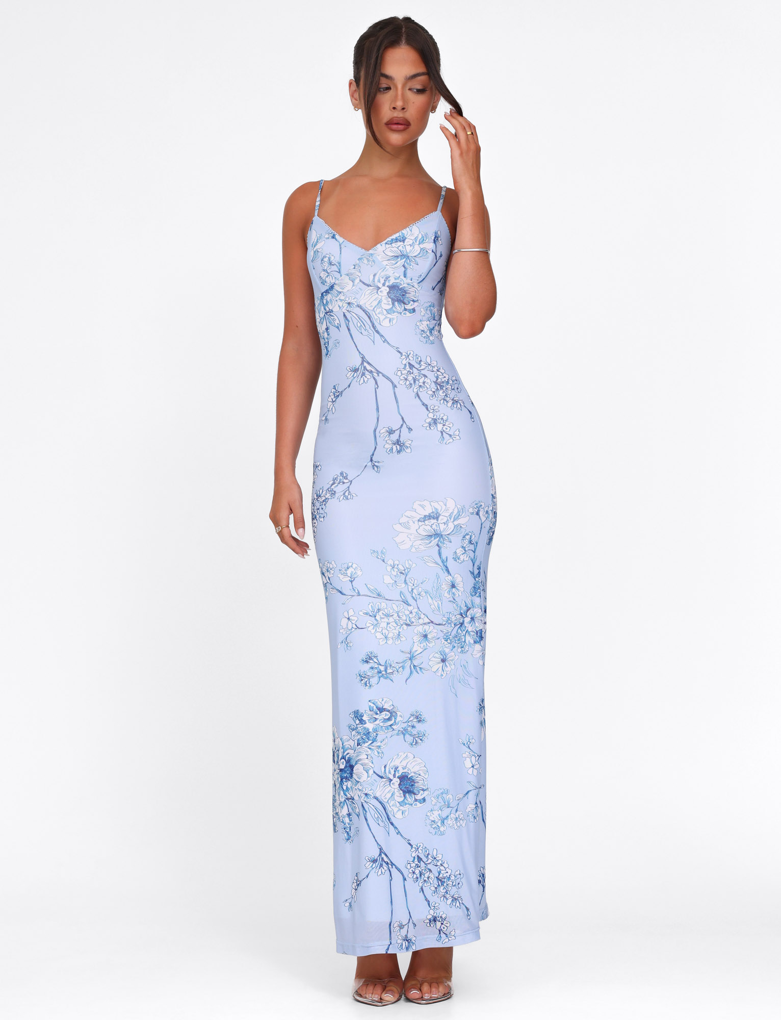 Blue and white botanical maxi dress with V-neckline and fitted silhouette