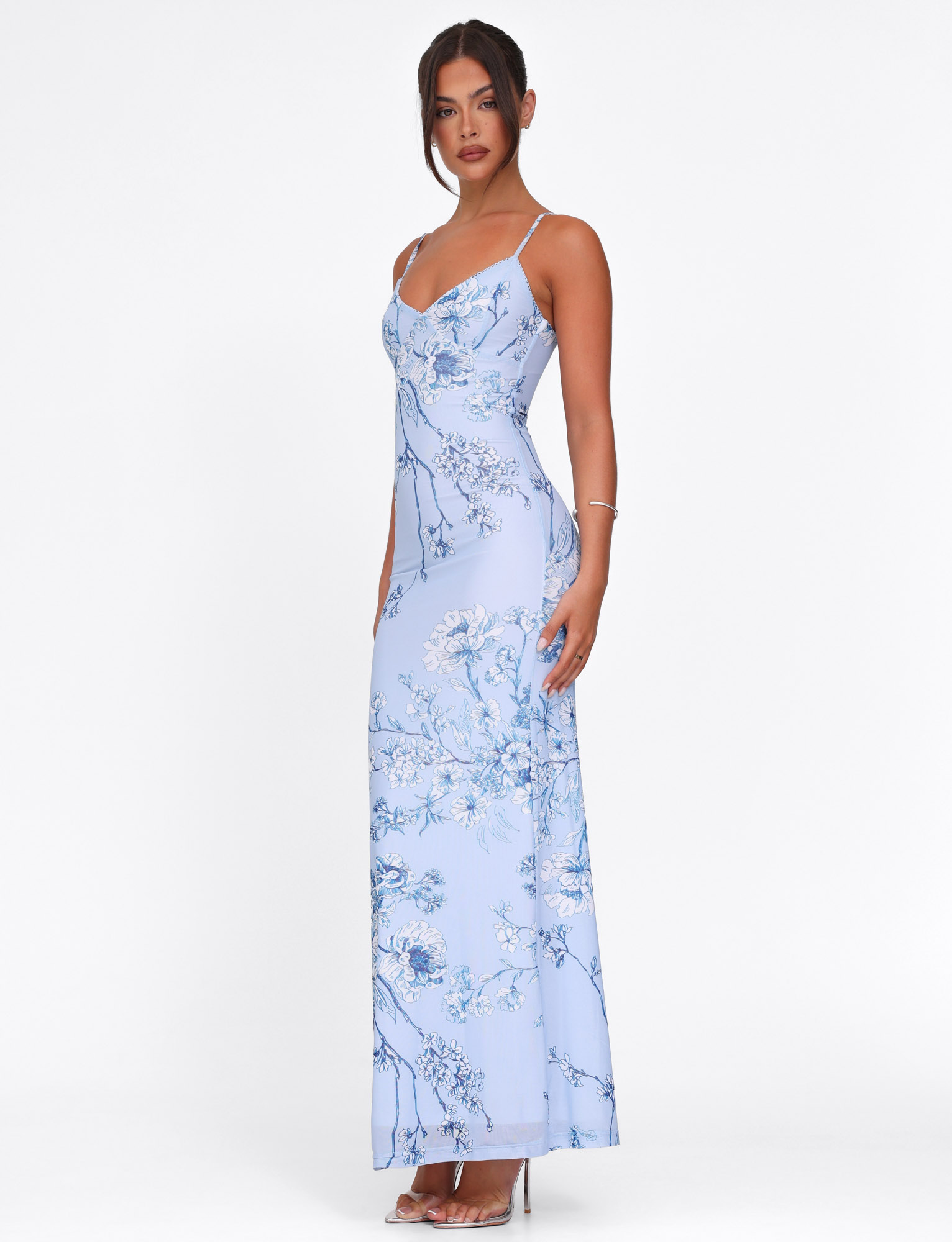 Blue floral maxi dress with V-neckline and flowing botanical pattern