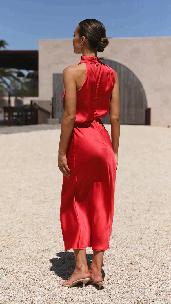 Back view of red draped midi dress with halter neckline