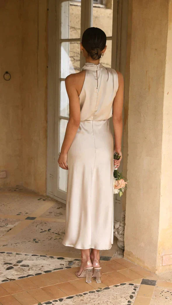 Back view of cream midi dress showing button-down closure