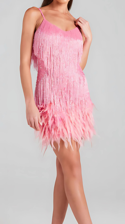 Side view of pink fringe sequin mini dress with layered hem