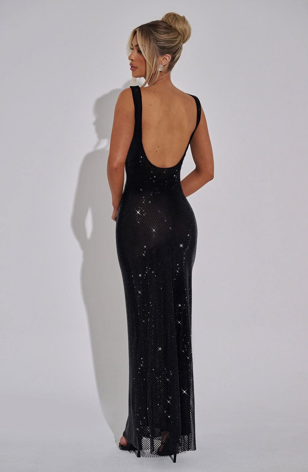 Black sequin maxi dress back view with open backless design