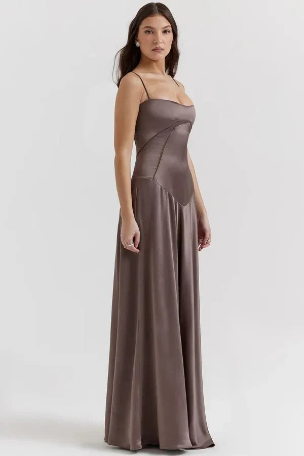 Side view of taupe corset maxi dress with asymmetrical bodice design