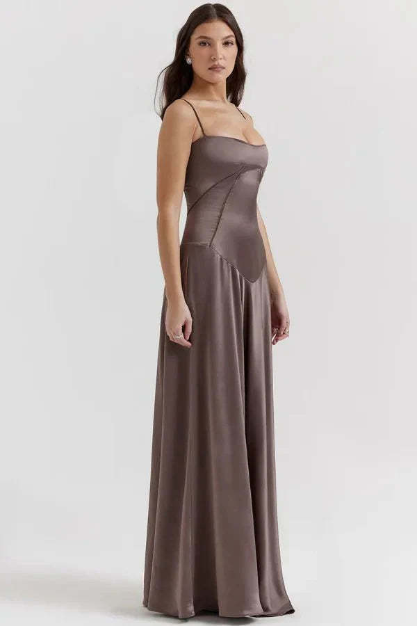 Side view of taupe corset maxi dress with asymmetrical bodice design