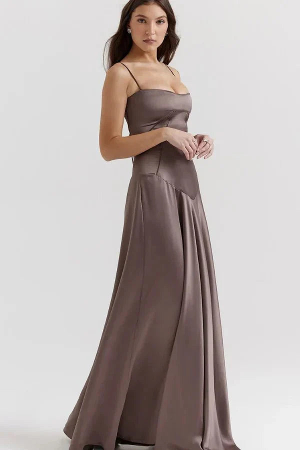 Front view of taupe maxi dress with structured corset and pleated skirt