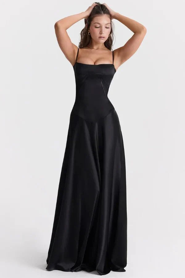 Black corset maxi dress with thin straps and flowing skirt