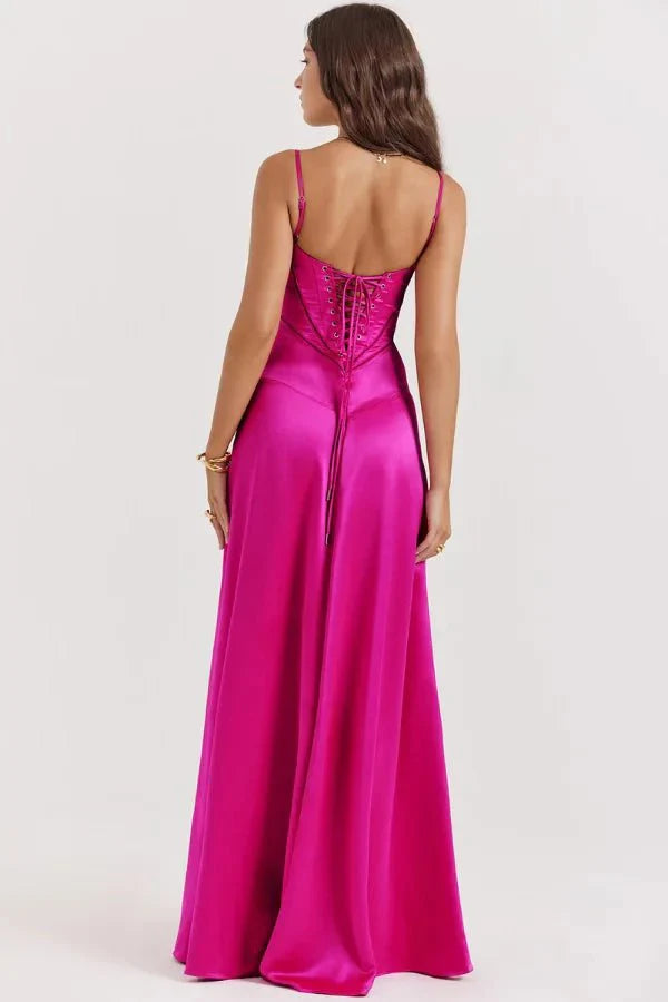 Magenta corset maxi dress outdoor shot showing draped skirt and structured bodice