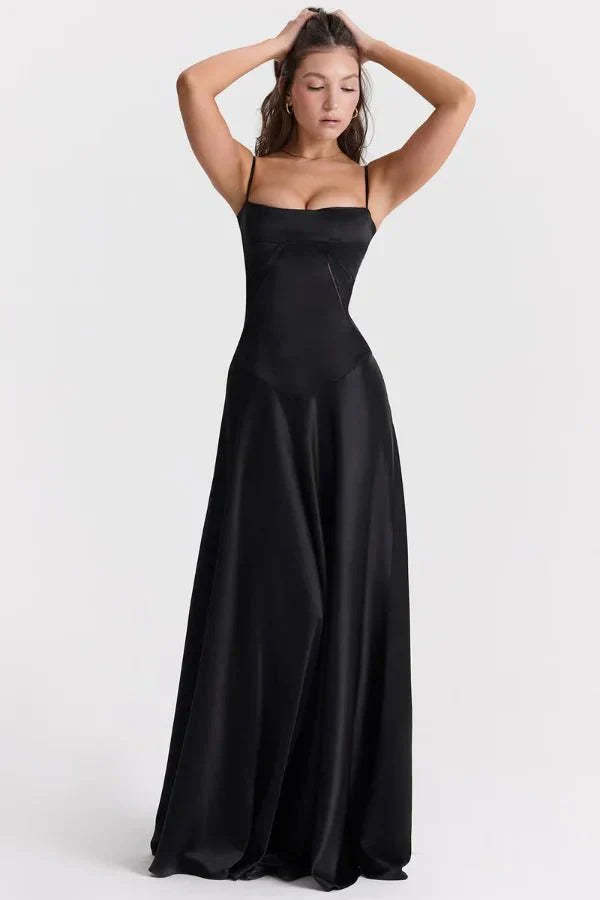 Black corset maxi dress with thin straps and flowing skirt