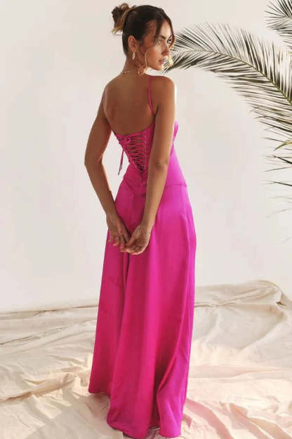 Back view of magenta corset maxi dress with lace-up corset back