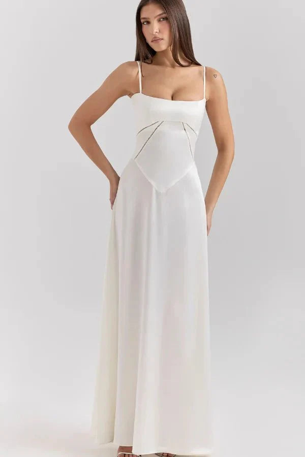 Cream corset maxi dress with spaghetti straps and structured bustier bodice