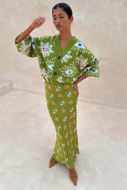Green eye motif knit cardigan and matching skirt set with white eyelash details and pink hearts
