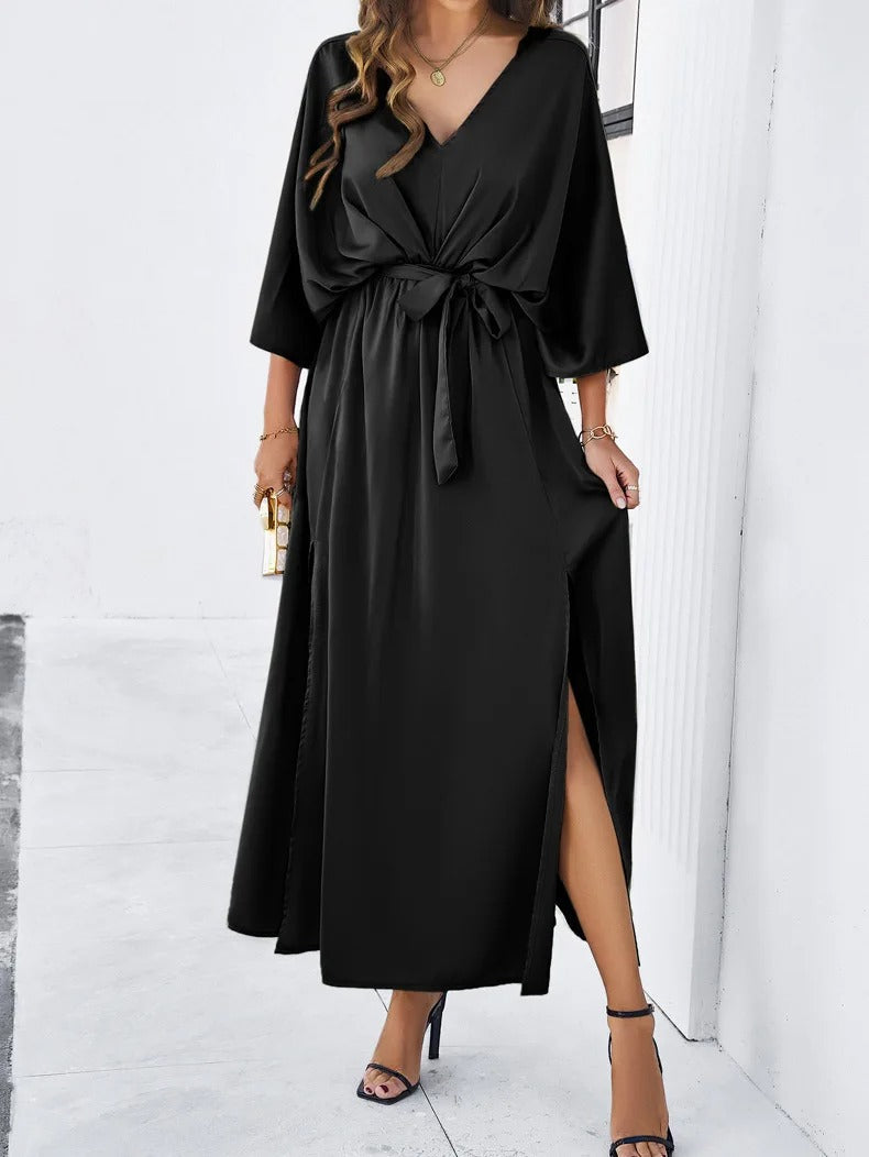 Black wrap maxi dress with batwing sleeves and side slit detail for wedding guests