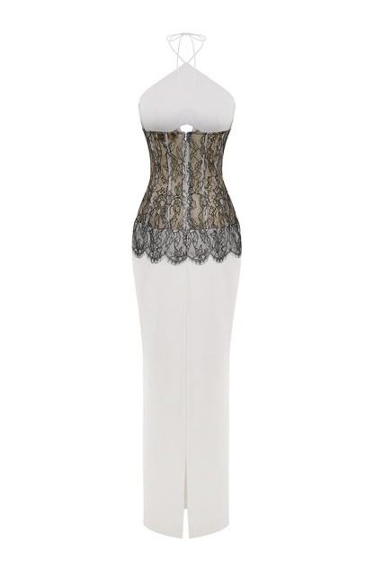 Back view of lace maxi dress showing black lace panel and center slit