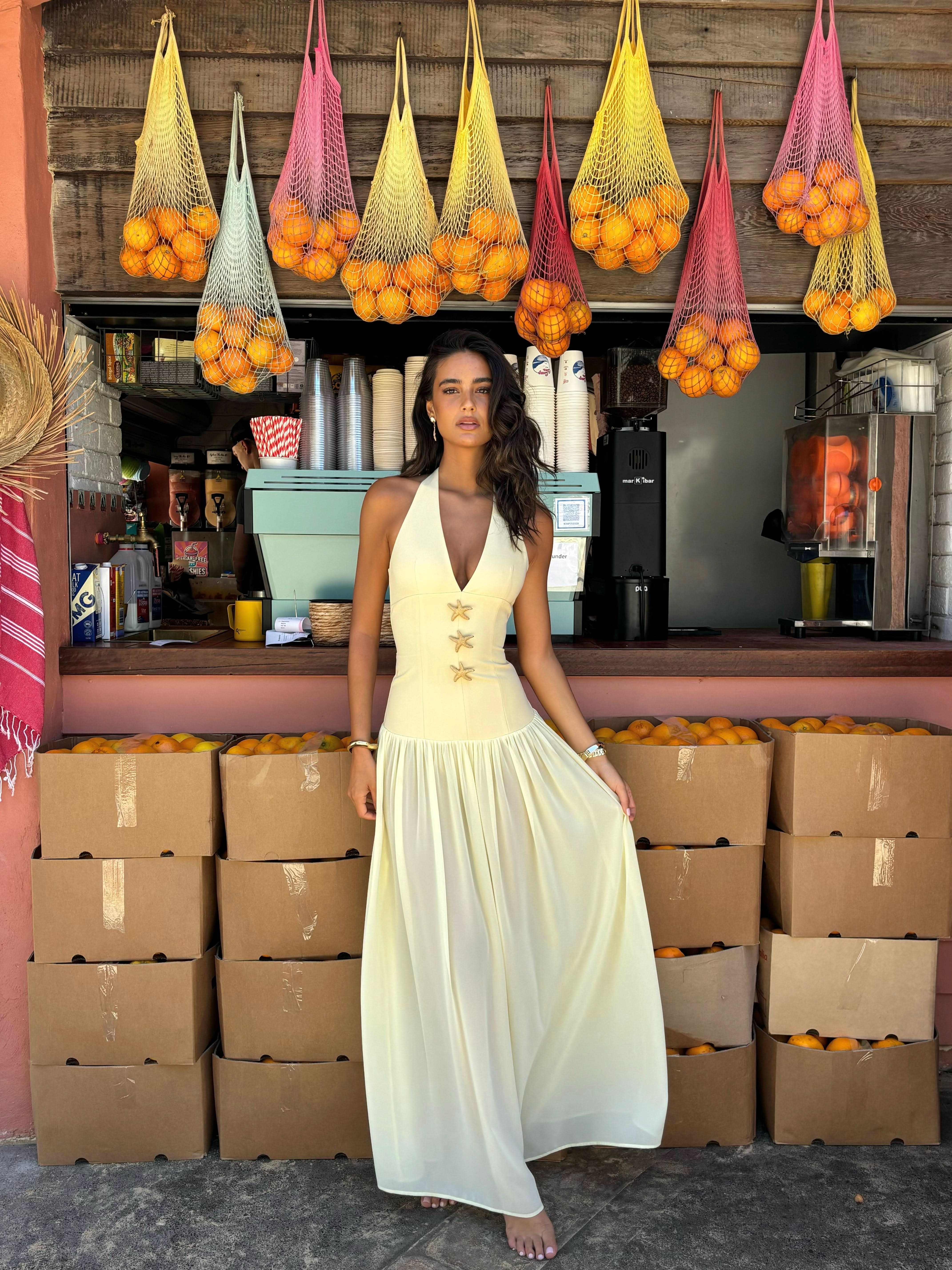 Cream halter maxi dress with gold starfish embellishments and flowing skirt