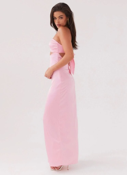 Side view of pink cutout maxi dress with gathered bodice
