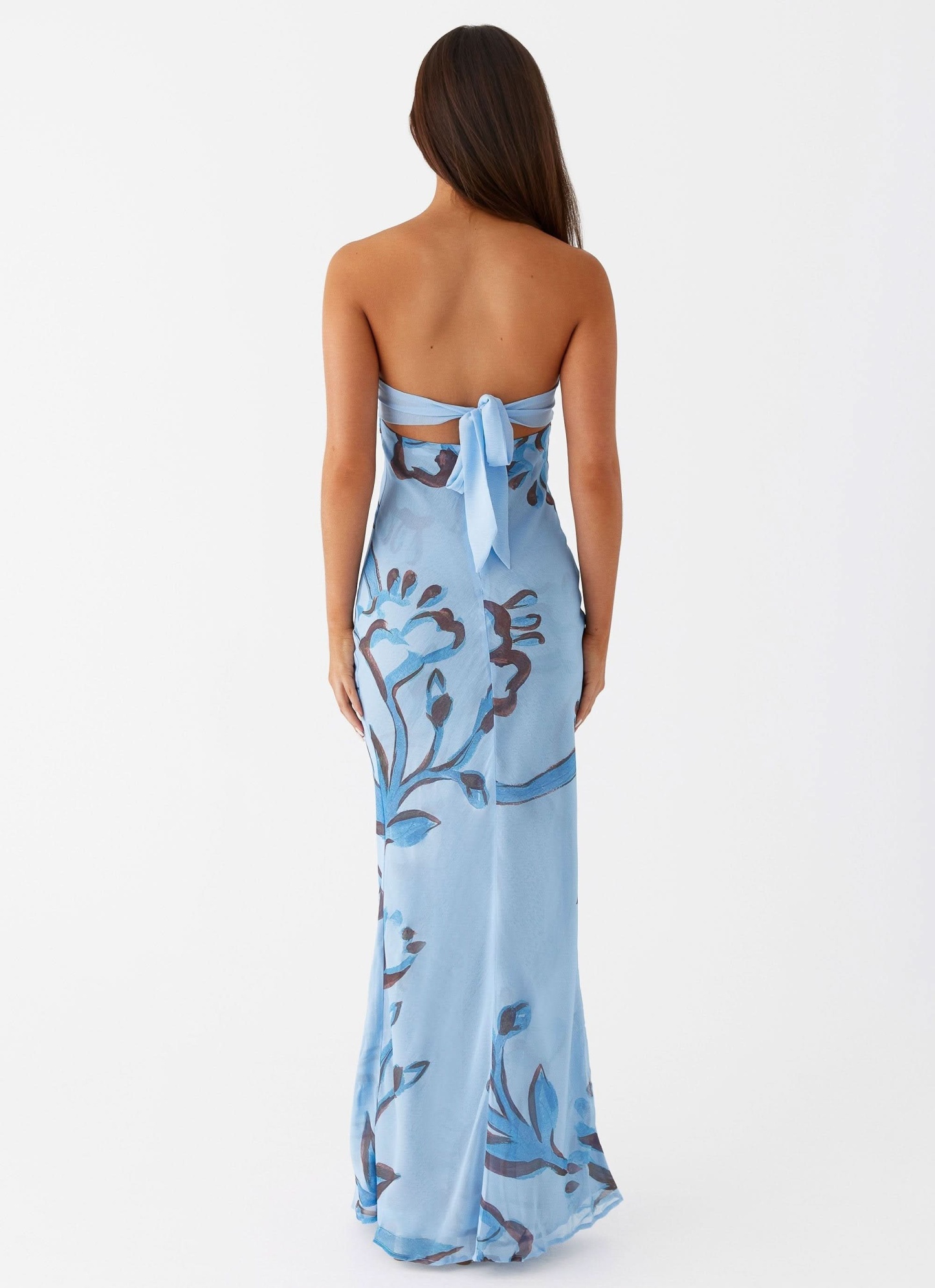 Back view of blue floral cutout maxi dress with tie