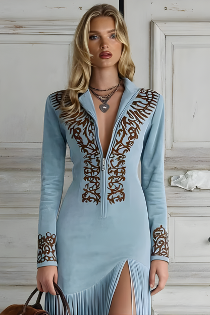 Close-up of Dakota maxi dress showing ornate brown embroidery on half-zip collar, yoke, and long sleeves