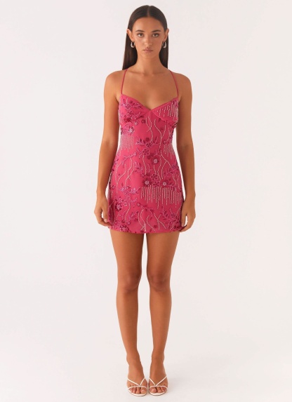 pink sequin mini dress with sweetheart neckline and beaded embellishment