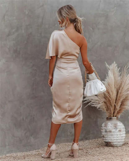 Back view of beige draped midi dress with flutter sleeve and fitted waist