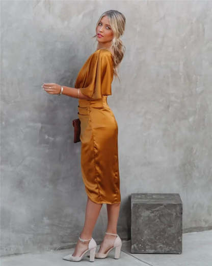 Back view of gold draped midi dress with flutter sleeve and ruched waist