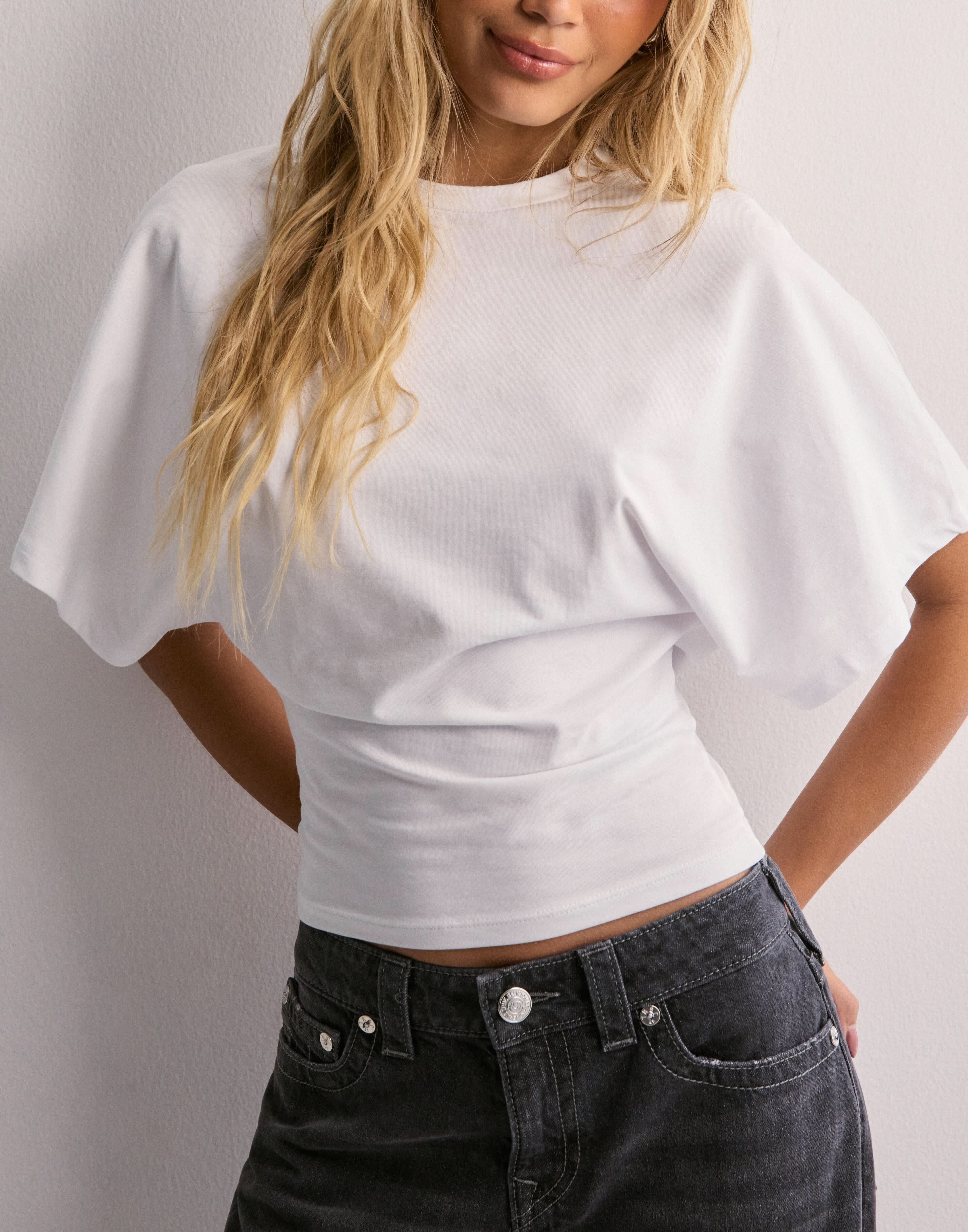 White batwing crop top with oversized flutter sleeves, front detail