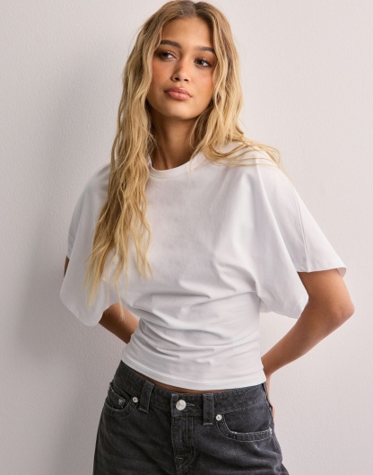 Charcoal batwing crop top with wide short sleeves, side back view