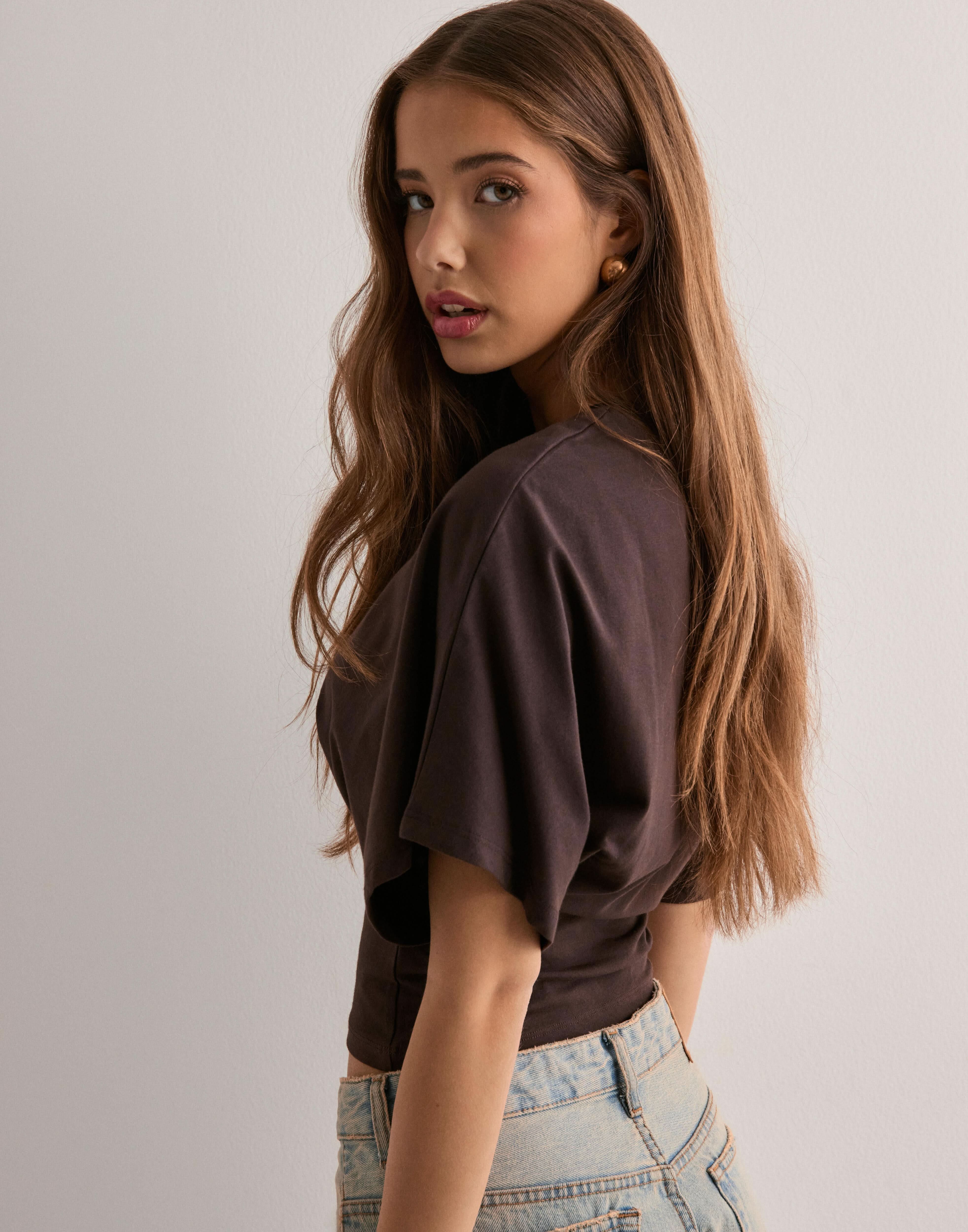 Brown batwing crop top with flutter sleeves and cinched waist detail