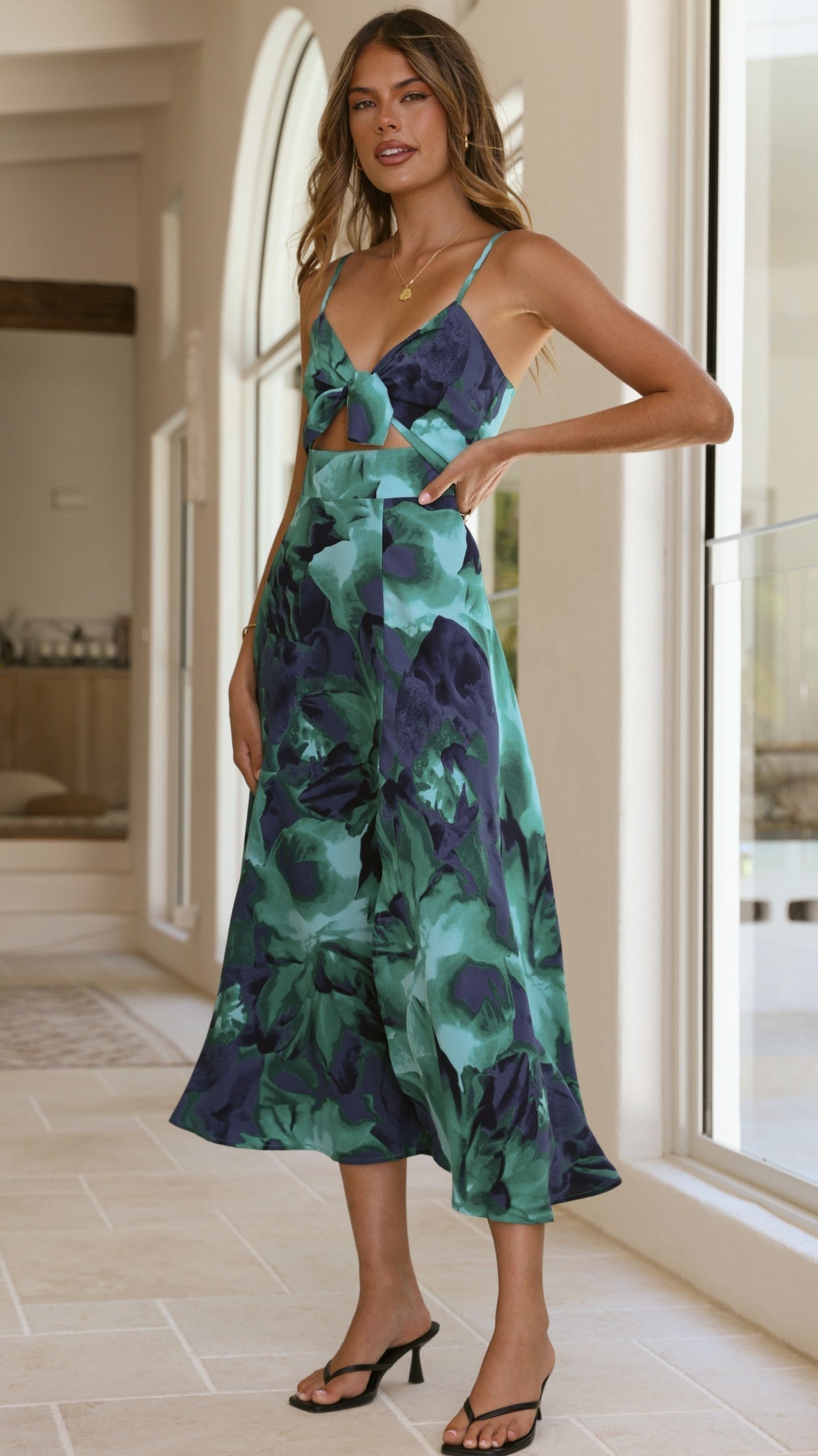 Green abstract floral midi dress with cutout waist and asymmetrical hem