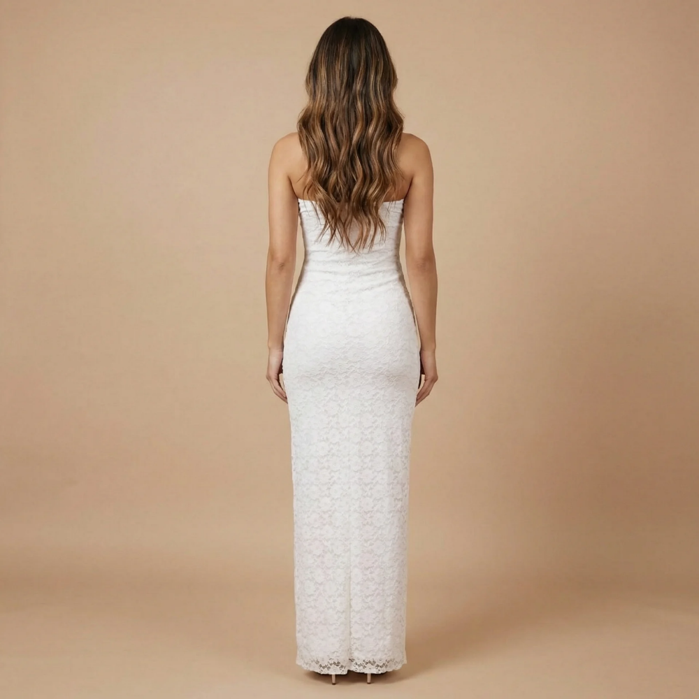 Back view of white lace strapless maxi dress with ruffled asymmetrical hem