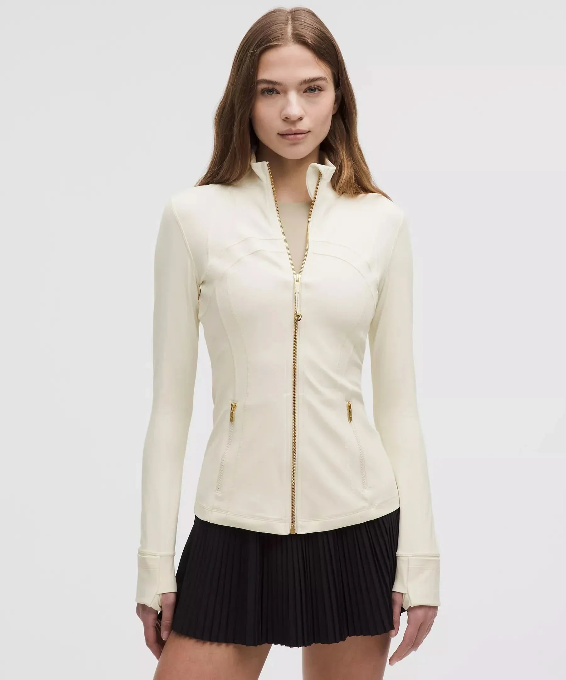 Cream contoured zip jacket with gold accents and side waist pockets