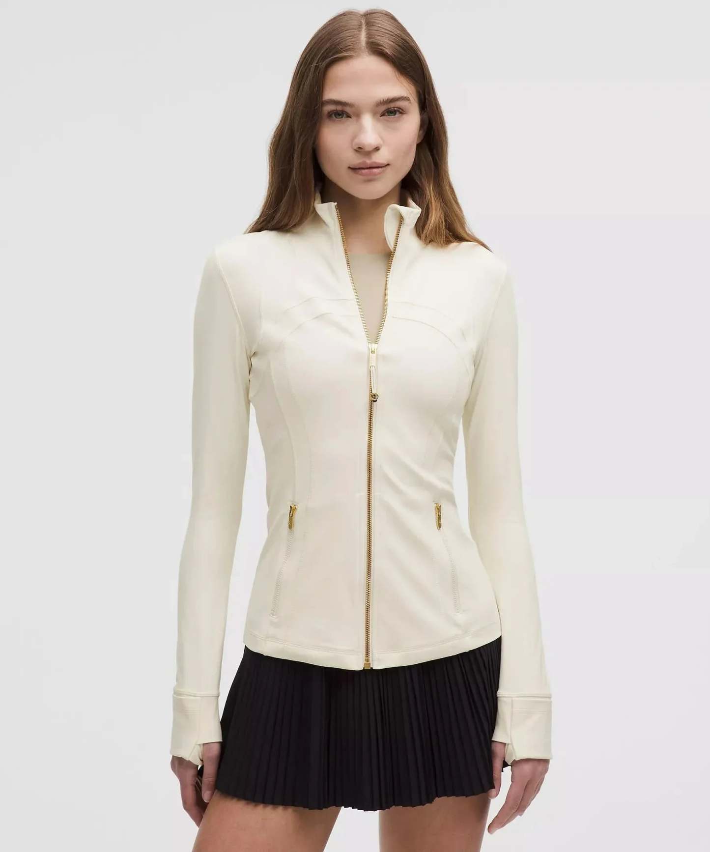 Cream contoured zip jacket with gold accents and side waist pockets
