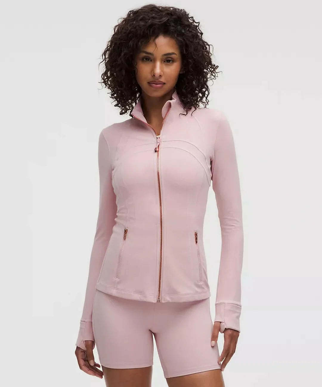 Pink contoured zip jacket with curved seaming and fitted silhouette