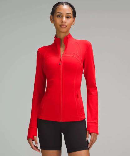 Red contoured zip jacket with curved body-hugging seams and cuffs