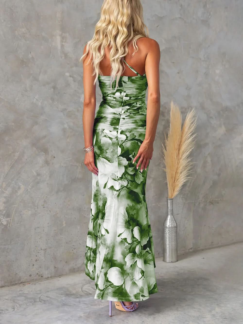 Green and white floral ruched maxi dress, back view showing fitted bodice