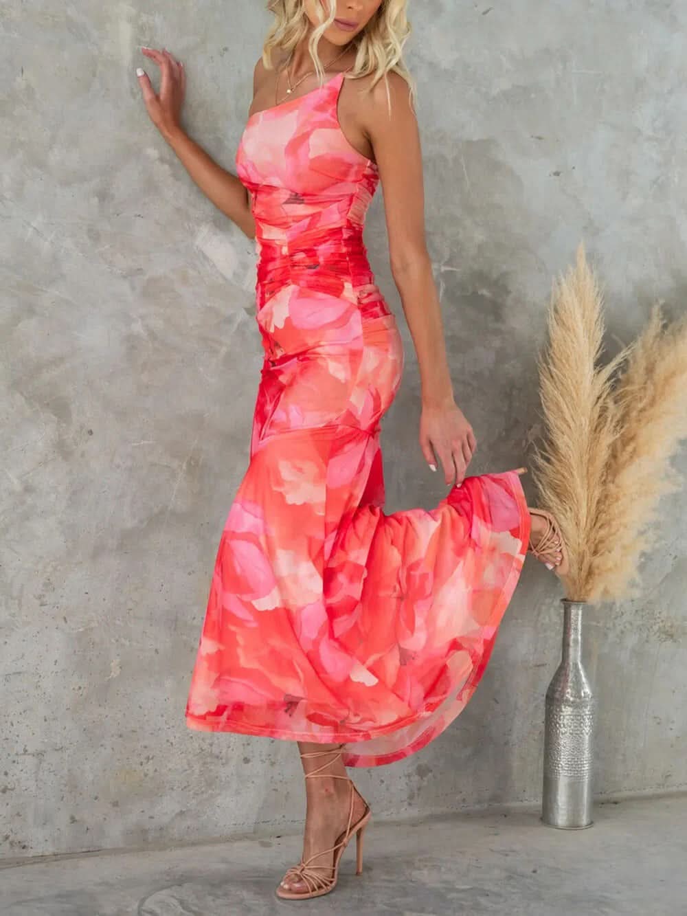 Coral pink floral ruched maxi dress side profile showing fitted waist detail