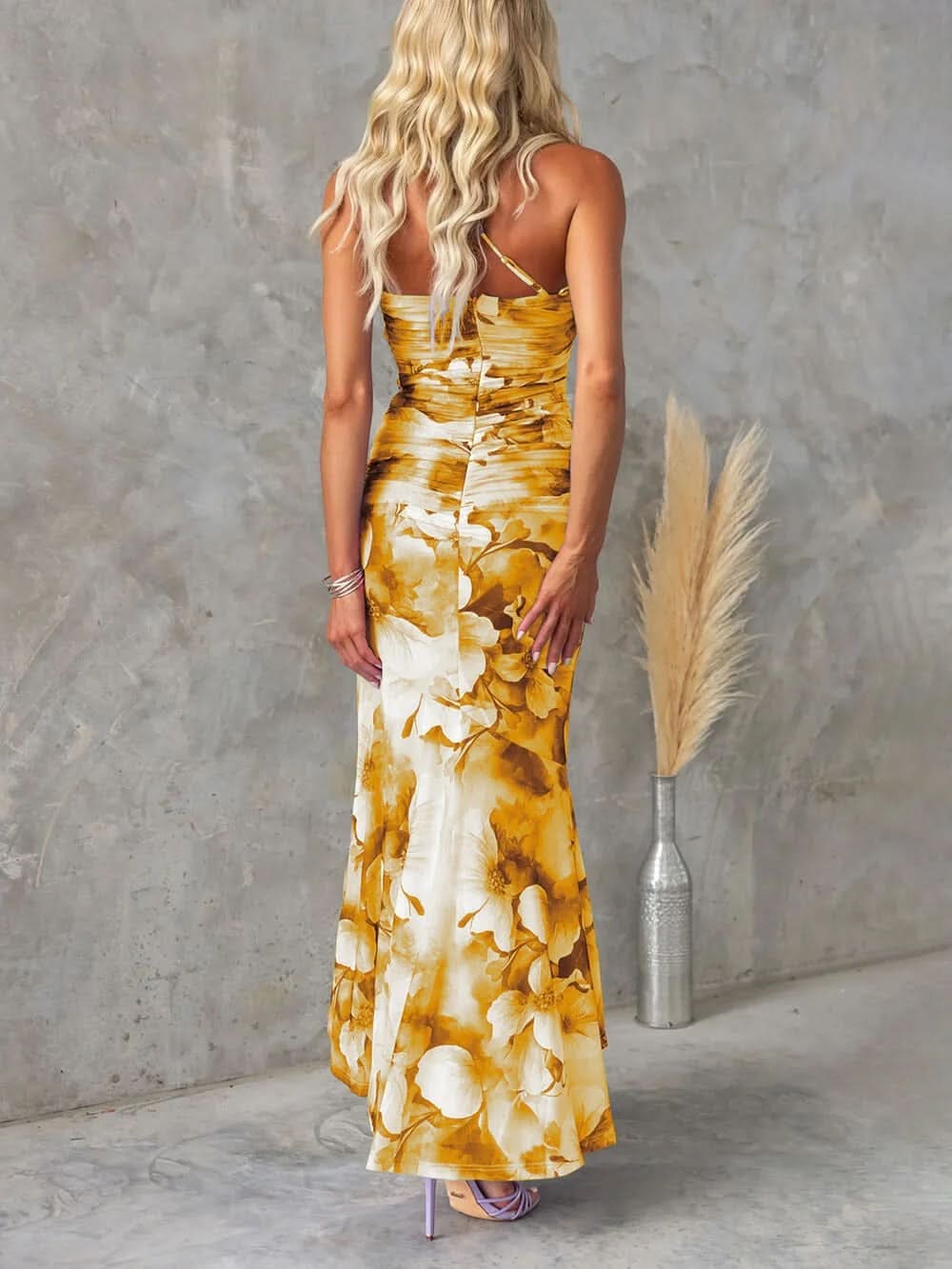 Back view golden yellow floral ruched maxi dress flowing hem