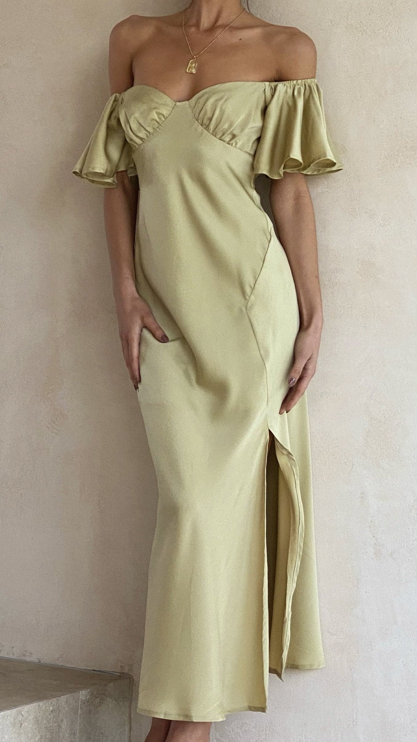 Cream off-shoulder midi dress with voluminous ruffle sleeves and wrap-style bodice