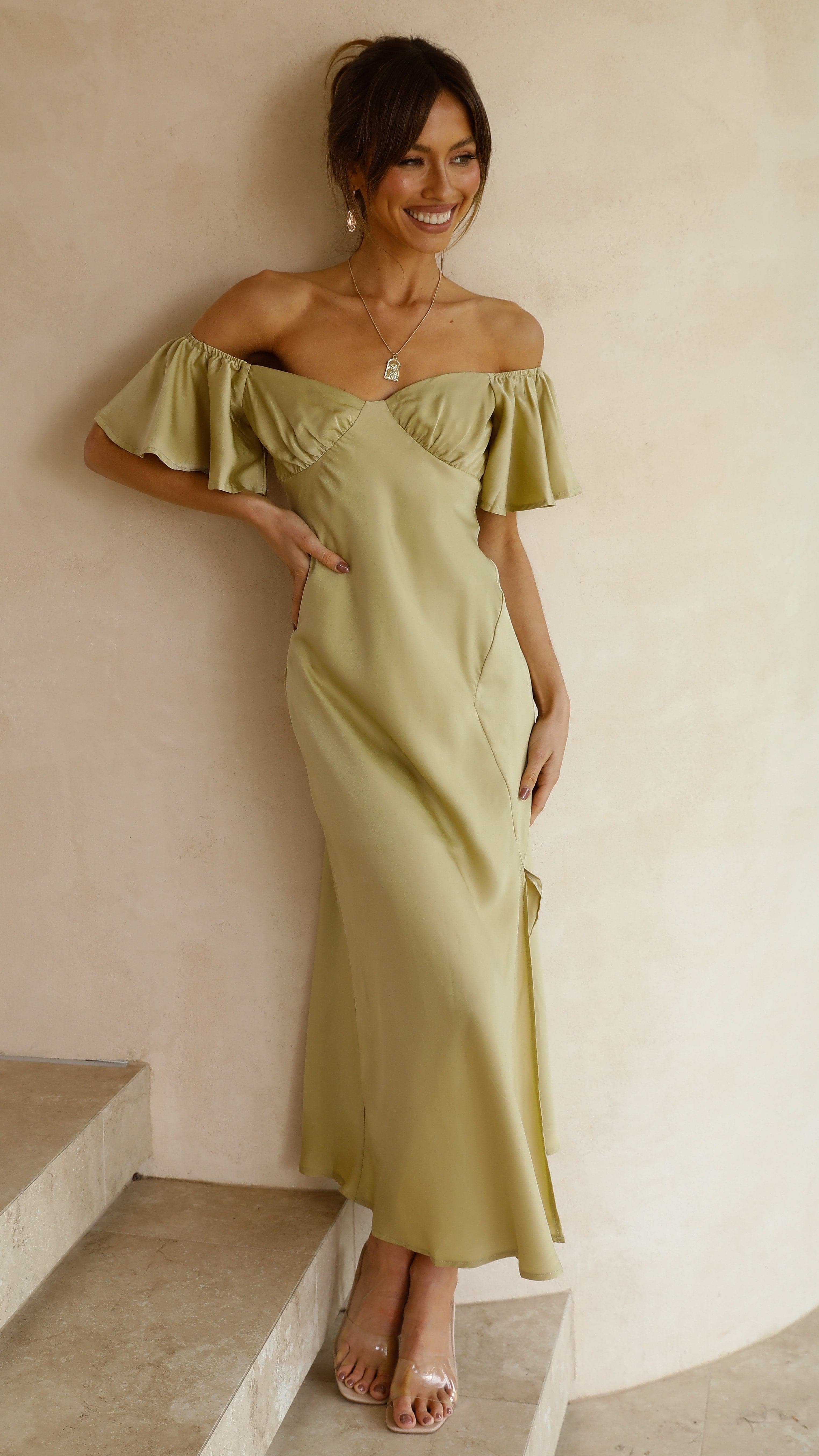 Soft yellow off-shoulder midi dress featuring ruffled short sleeves and fitted waist