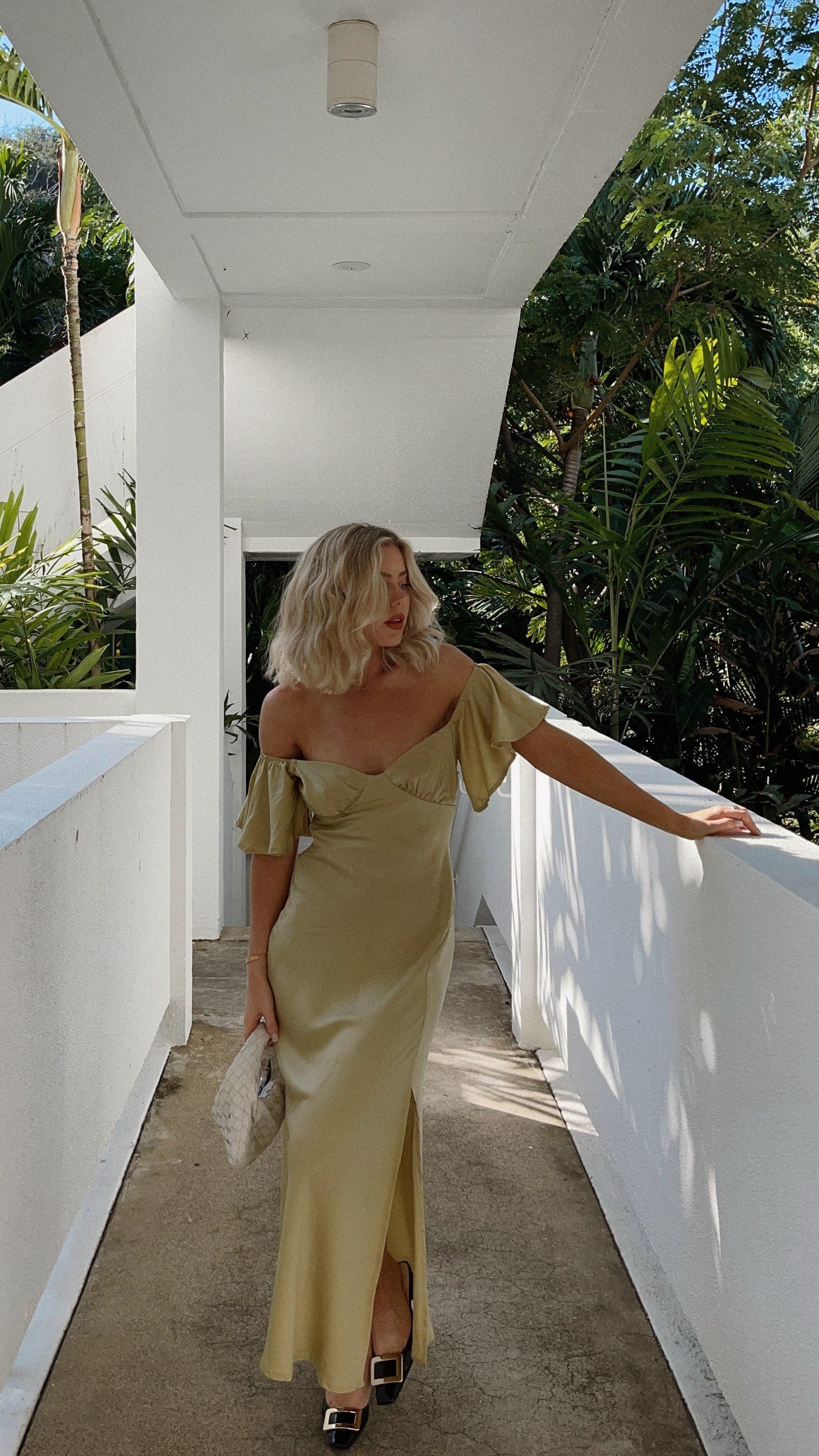 Pale yellow off-shoulder ruffle midi dress with short flutter sleeves and side slit