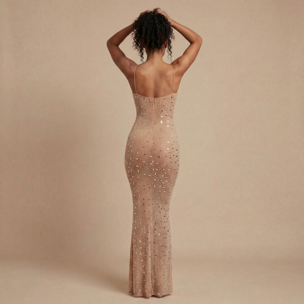 Back view of champagne sequin maxi dress showing open back and center-back zipper