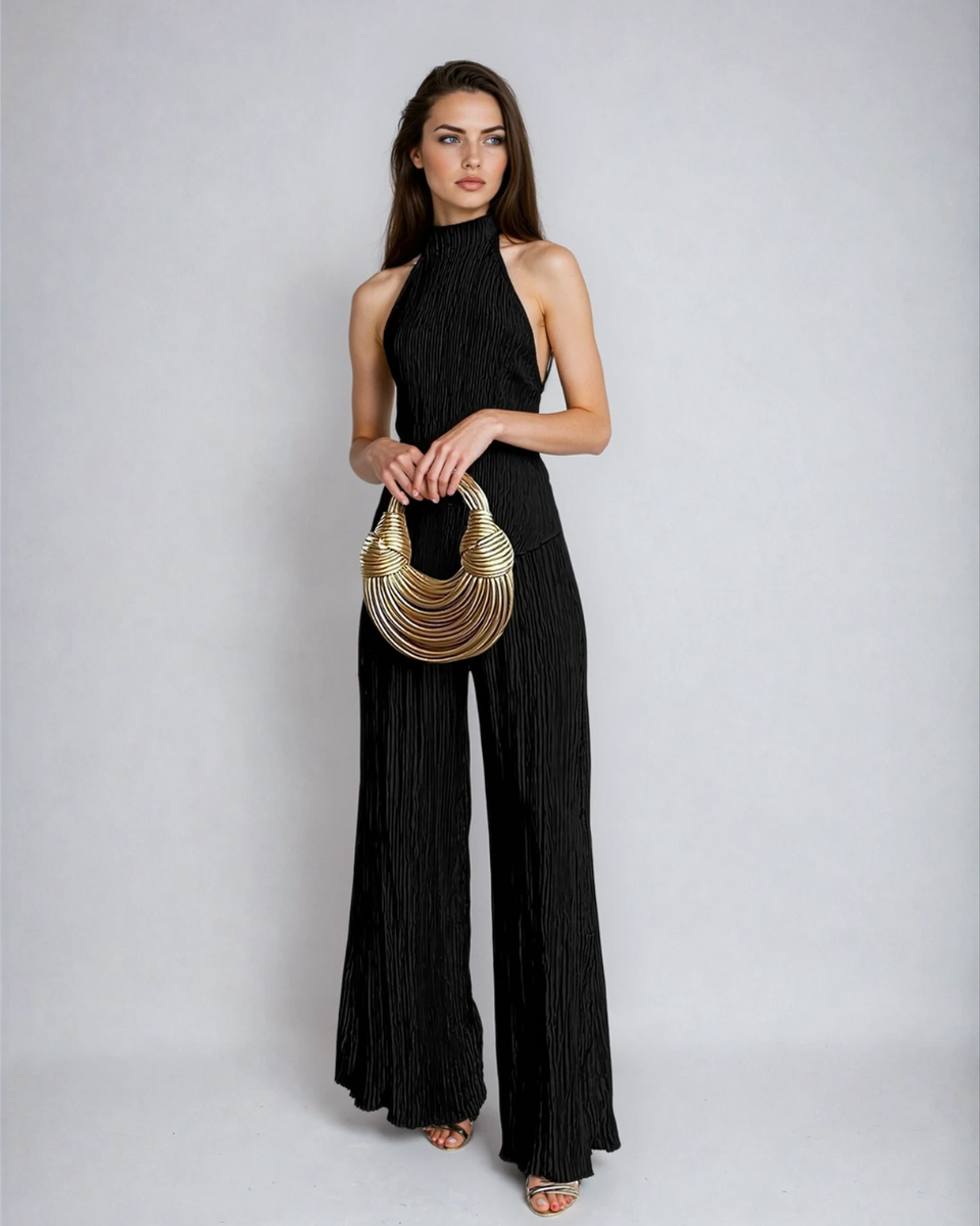 Black pleated halter neck pants set with sleeveless open back top and full-length wide legs