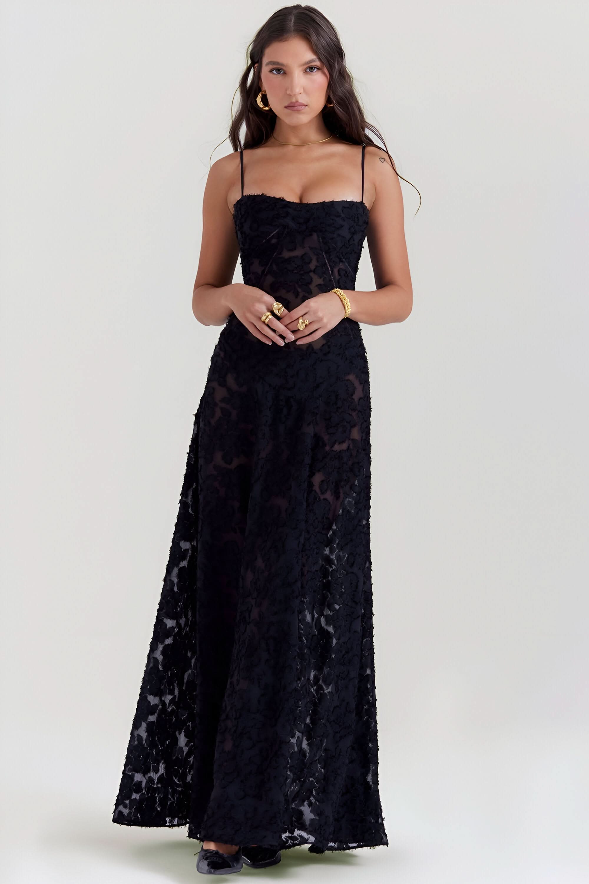 Black lace maxi dress front view with textured floral pattern