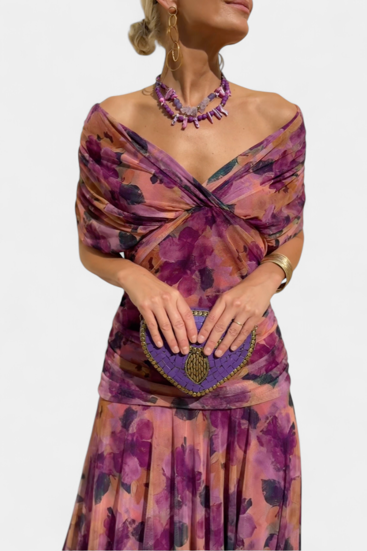 Purple floral maxi dress with twisted off-shoulder neckline and ruched bodice detail